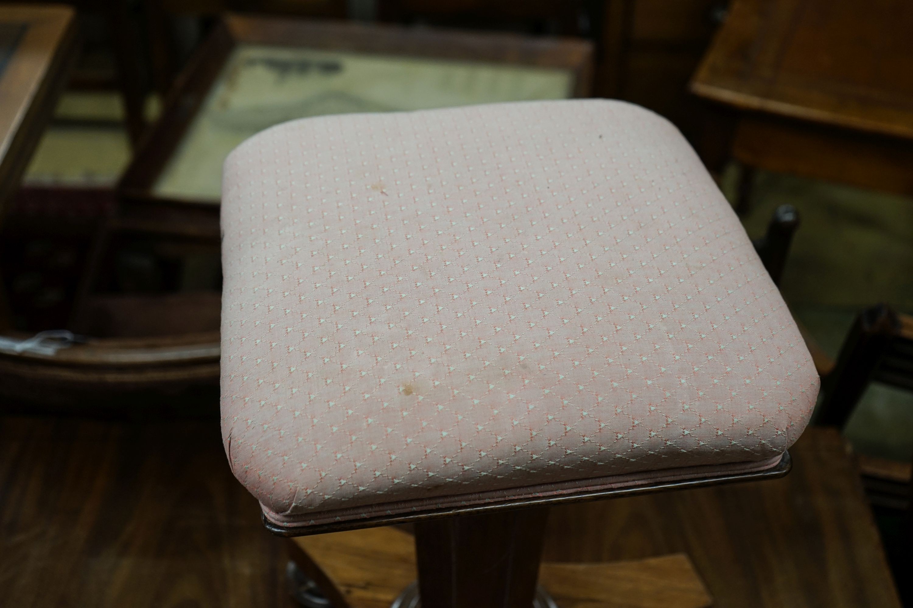 A Victorian faded rosewood adjustable piano stool